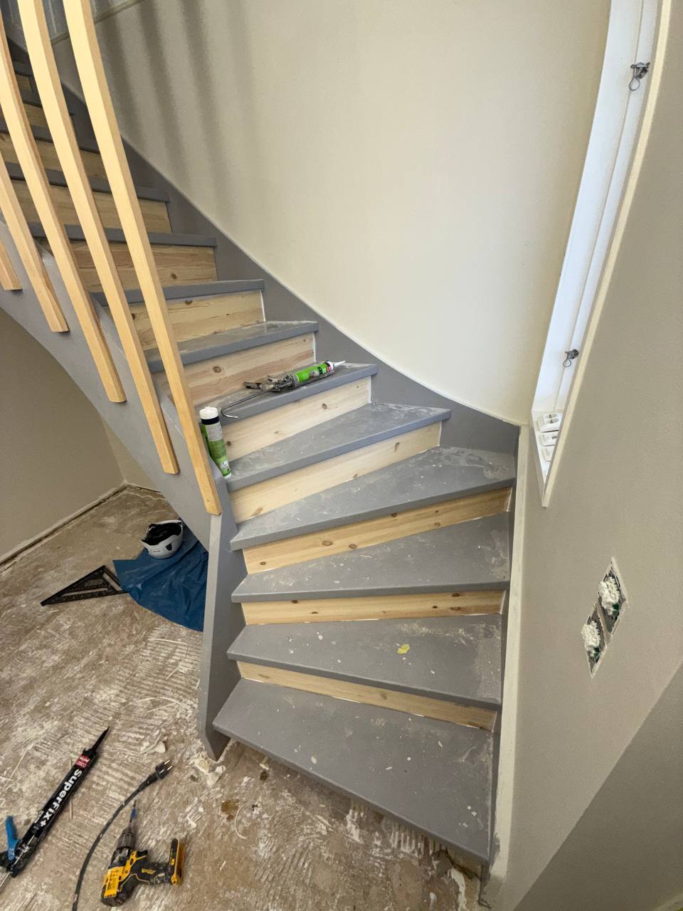 Refinished wooden staircase with grey risers